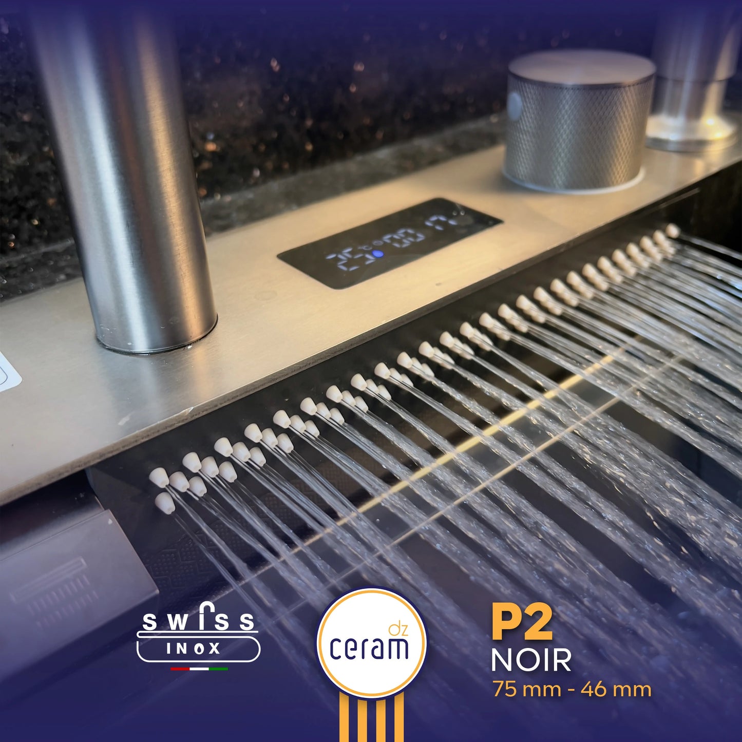 Stainless steel sink with water flow indicators and brand logos on a dark background